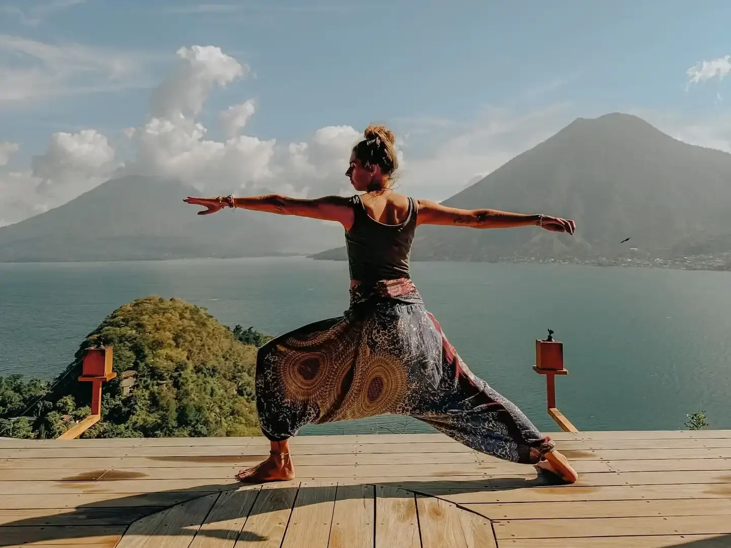 Ali doing yoga with volcano backdrop in Guatemala